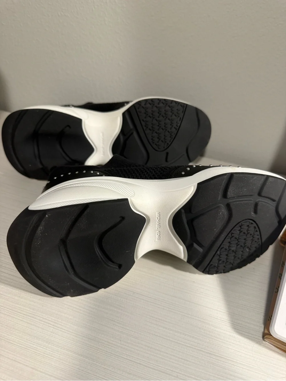 Michael Kors Zuma Black and White Zip-Front Platform Sneakers with Stud Detail